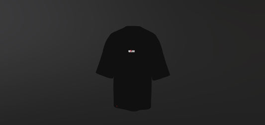 Minimalist Black Tee with Small Red & White Flag Chest Graphic